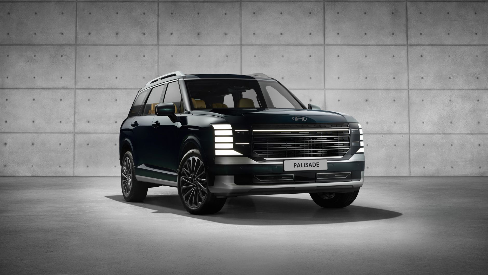 Sleek Hyundai Palisade SUV showcased in a modern indoor studio setting.