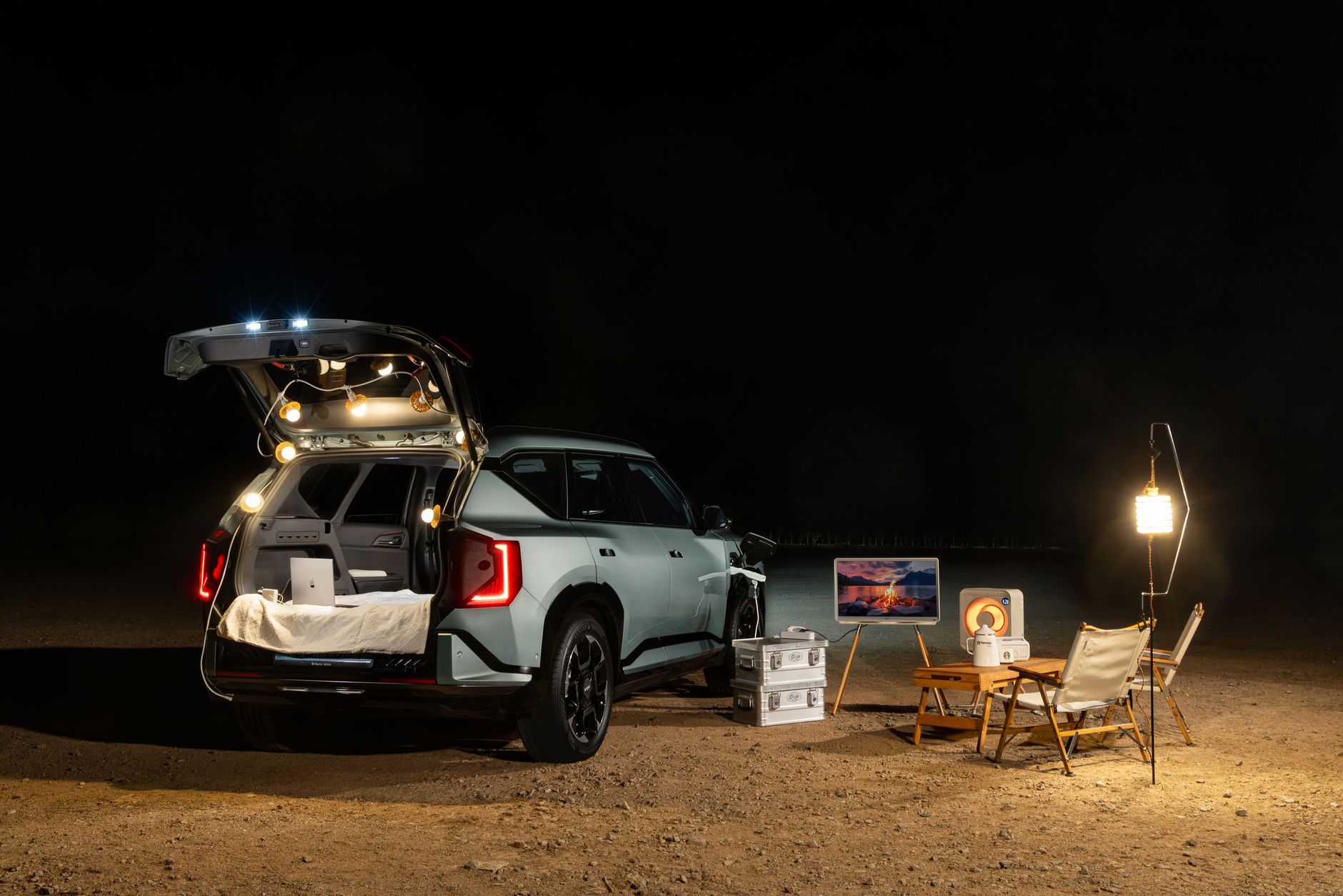Enjoy the perfect night camping outdoors with a car, cozy seating, and ambient lighting under the stars.