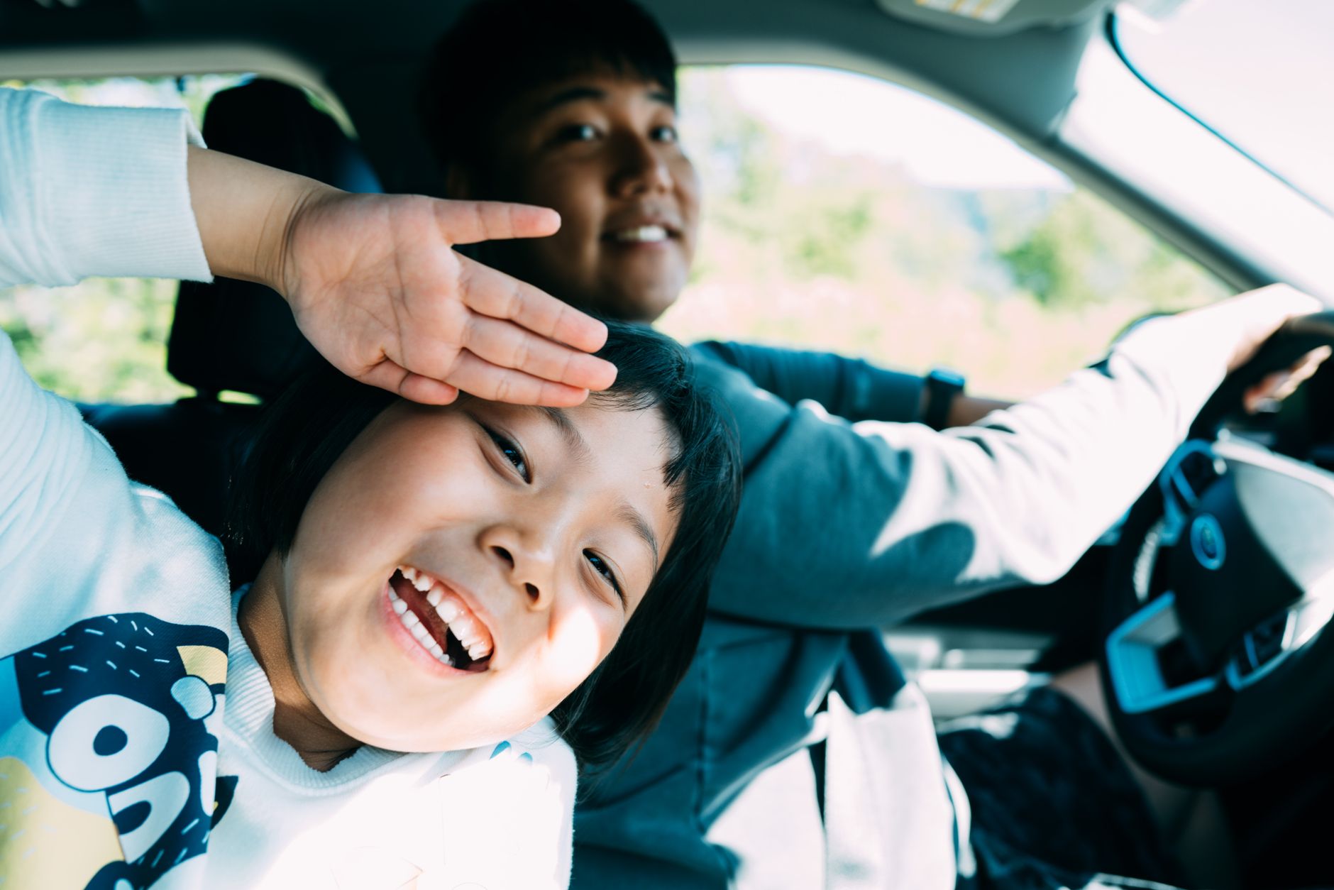 A cheerful father and child enjoying a fun-filled road trip together.