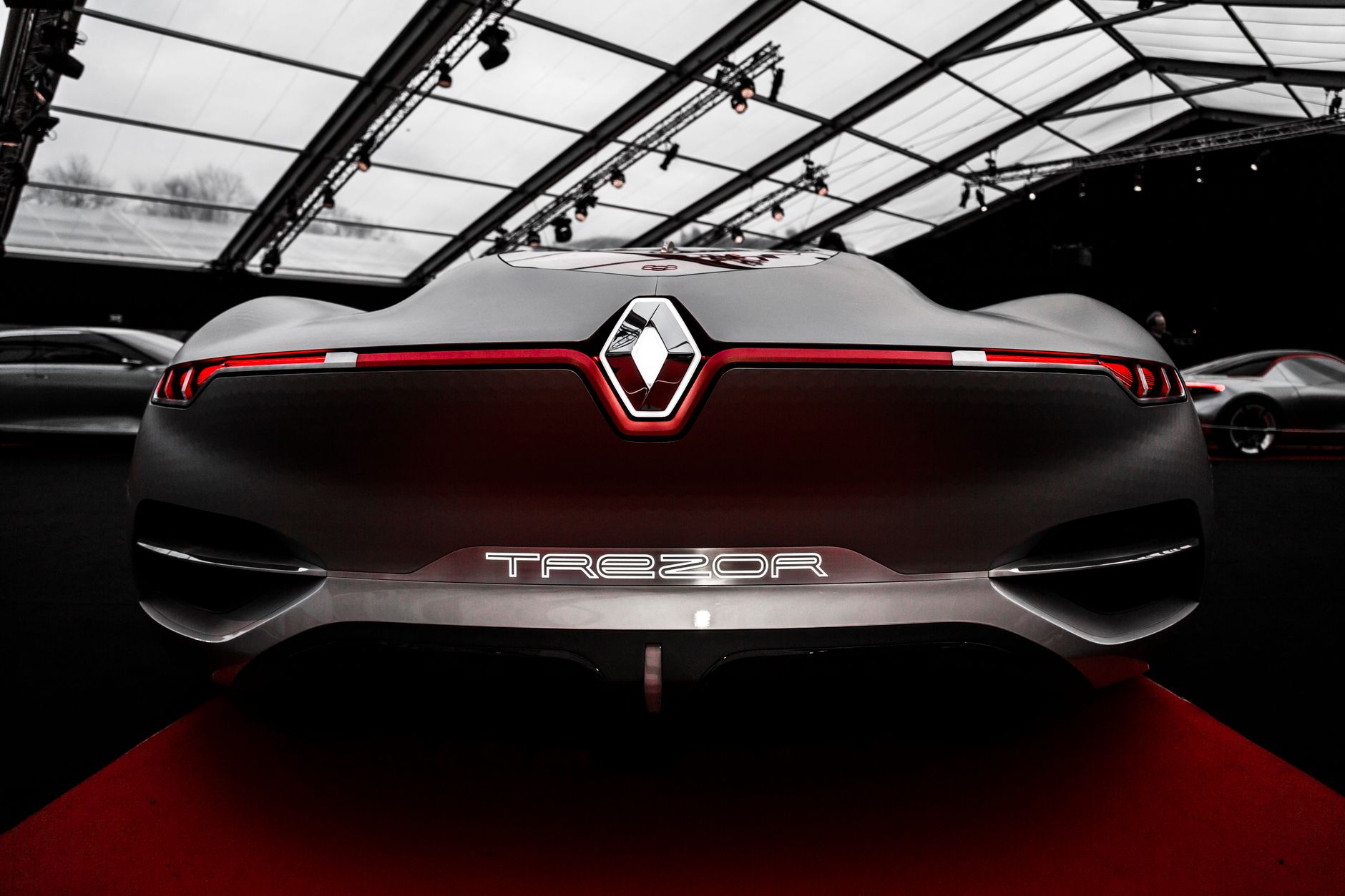Stunning rear view of the Renault Trezor concept car showcased indoors with futuristic design.